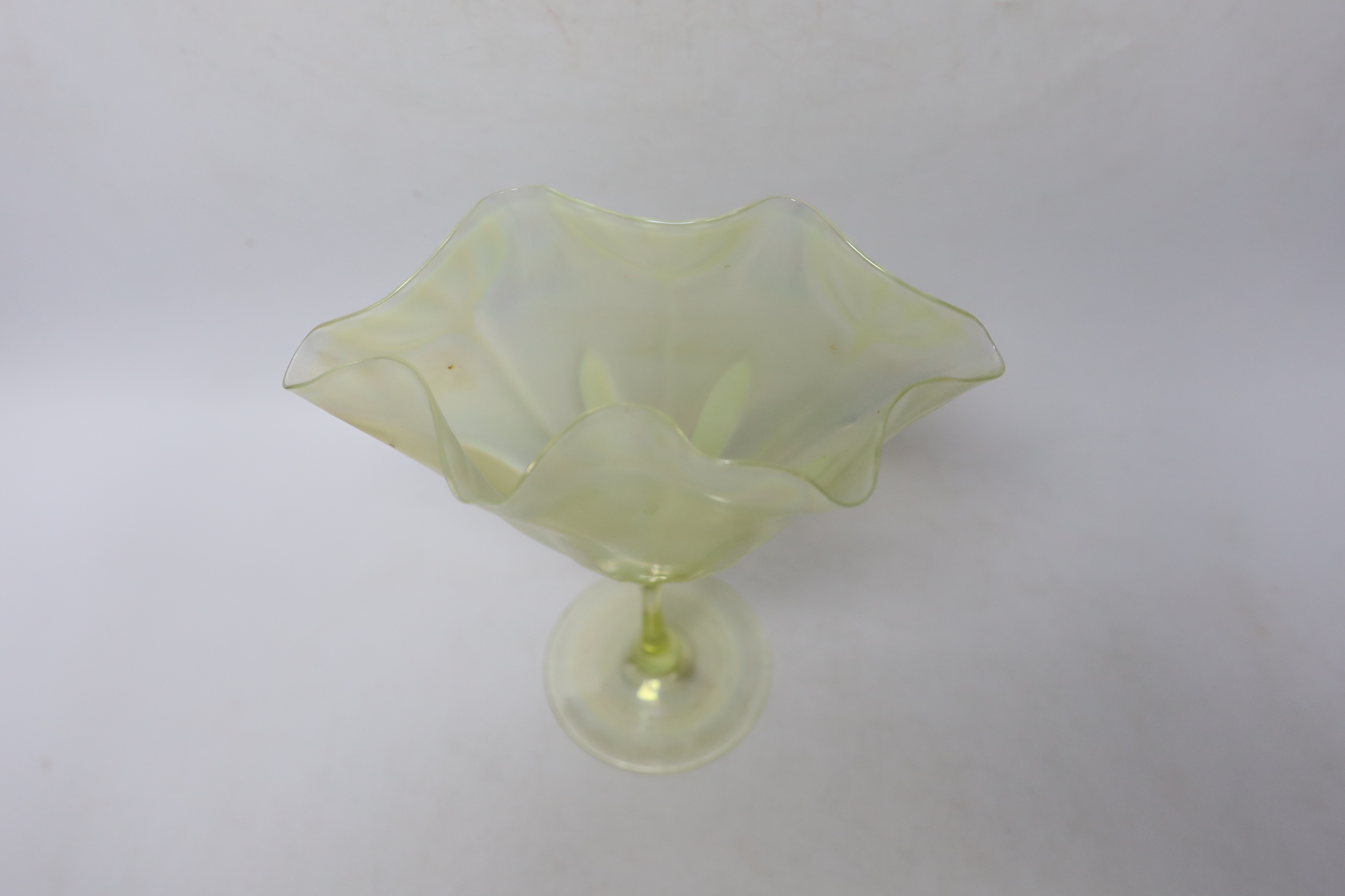 Attributed to Harry Powell for Whitefriars - an iridescent vaseline glass floriform vase, 21cm high
